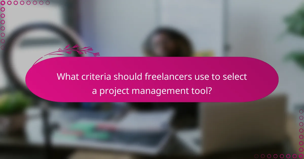 What criteria should freelancers use to select a project management tool?
